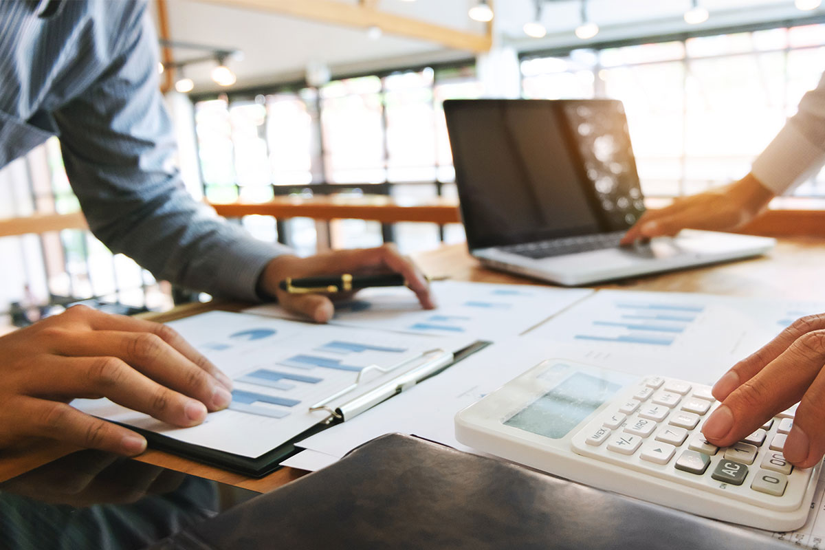 two men analyzing financial documents