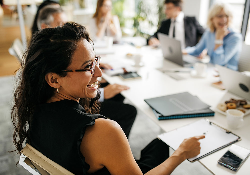 woman in meeting with with blurry background