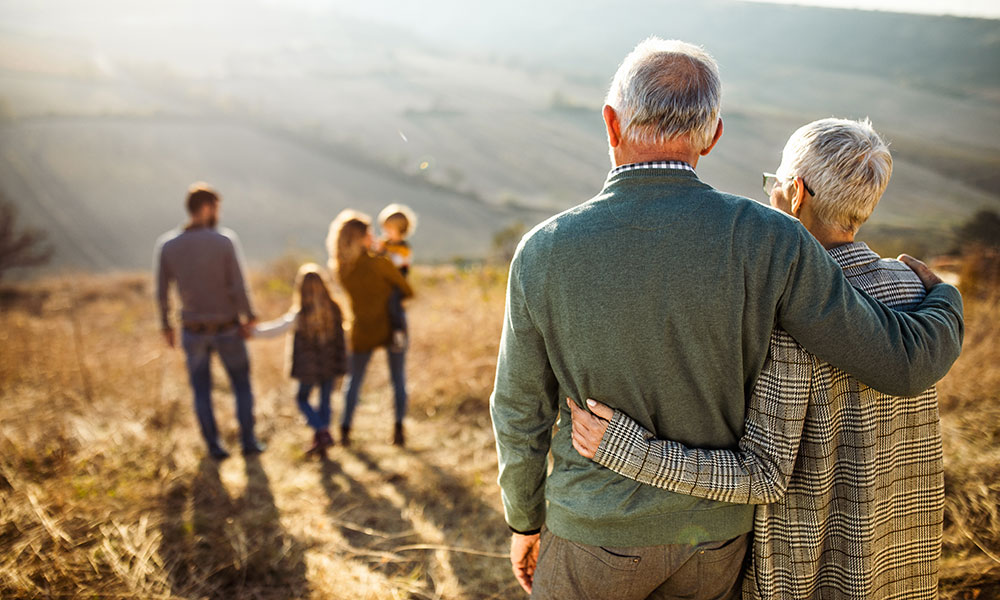 family standing together on hillside